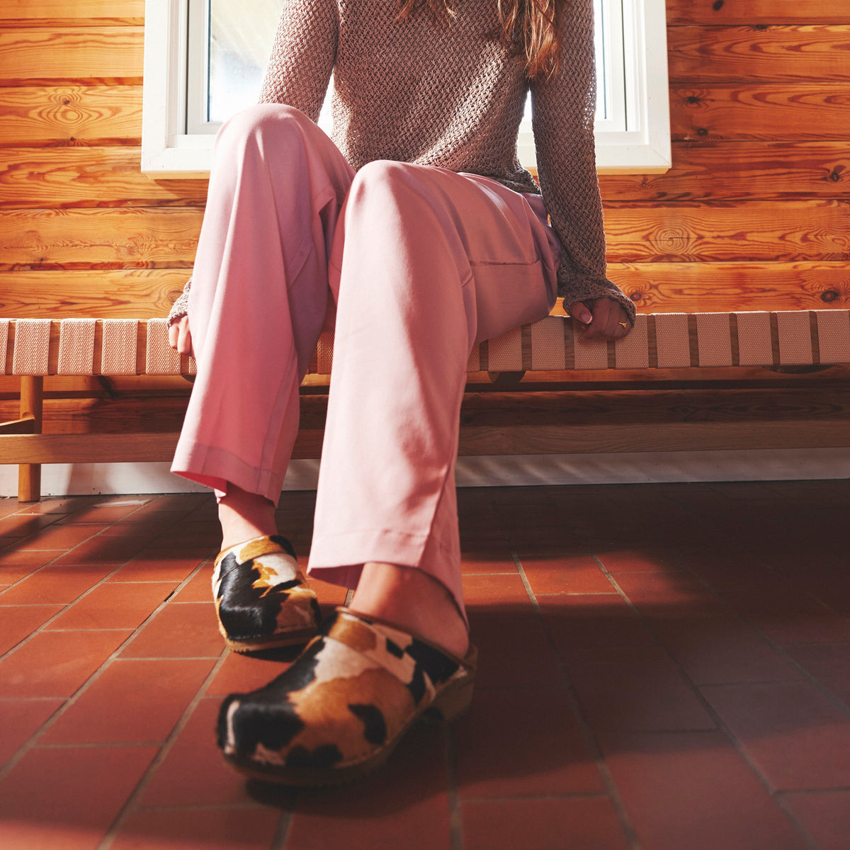 Caroline Cow Hair Clog on Model in Pink Pants
